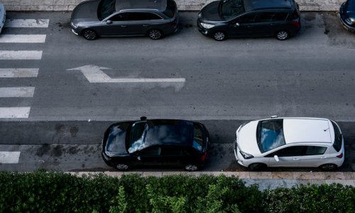 On-street parking areas are monitored by cameras or sensors.